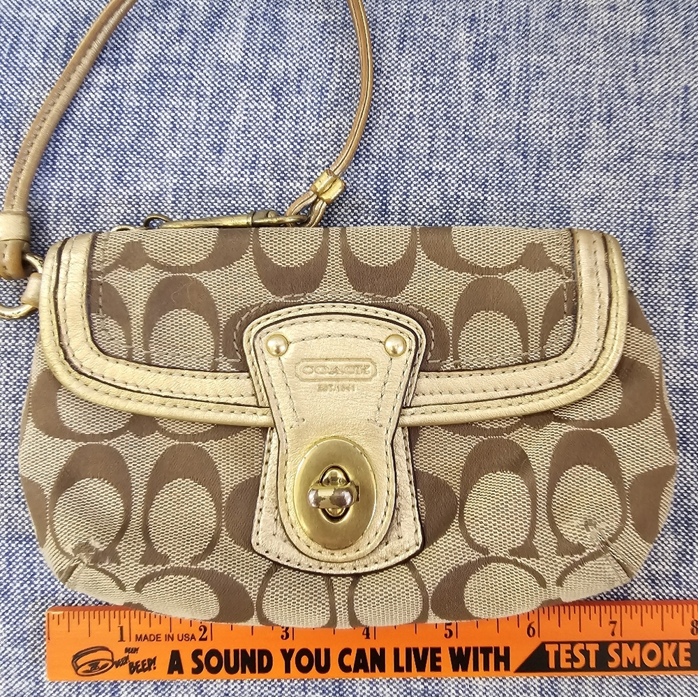 Coach signature C wristlet with gold trim purse